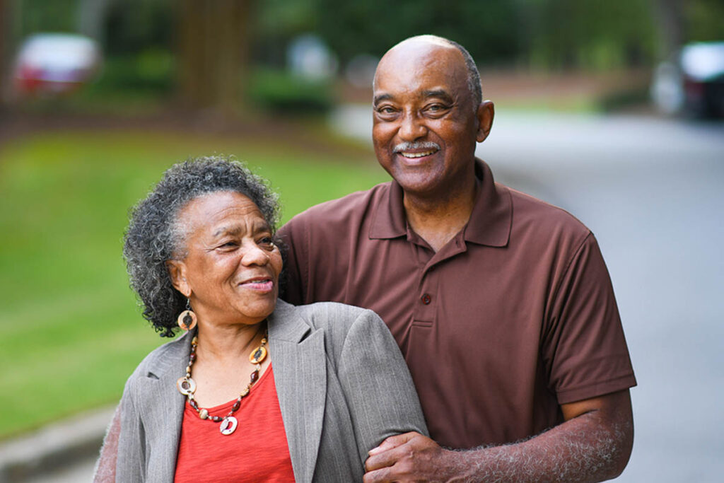 Elderly African American Man and woman posing together who just learned about Berks County Elder Law. Babyboomers.